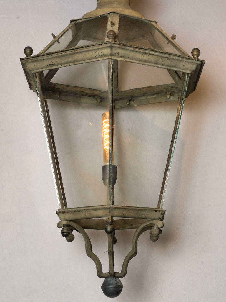 Vintage bronze-accented hanging lantern  