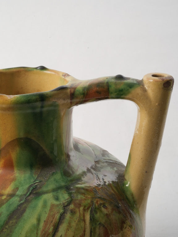 Brightly-hued historical ceramic pitcher  
