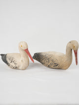Aged, charming, French garden storks