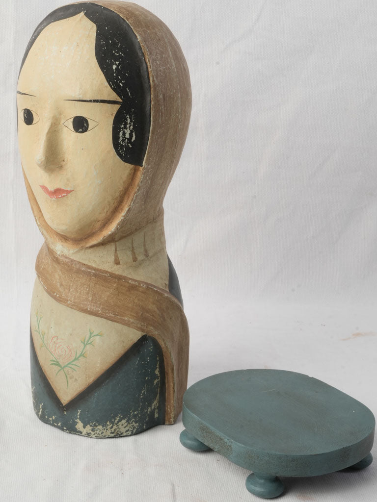 Graceful beige kerchiefed mannequin