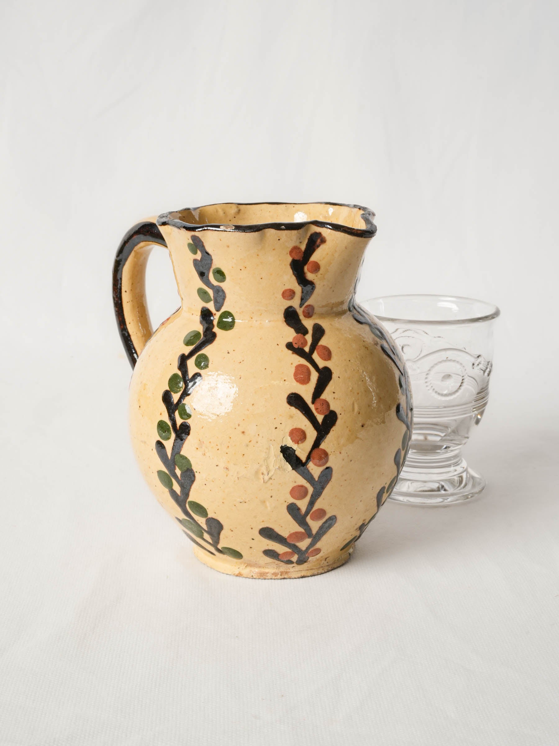 Pretty antique pitcher from Savoy - Yellow w/ foliage motifs 7"