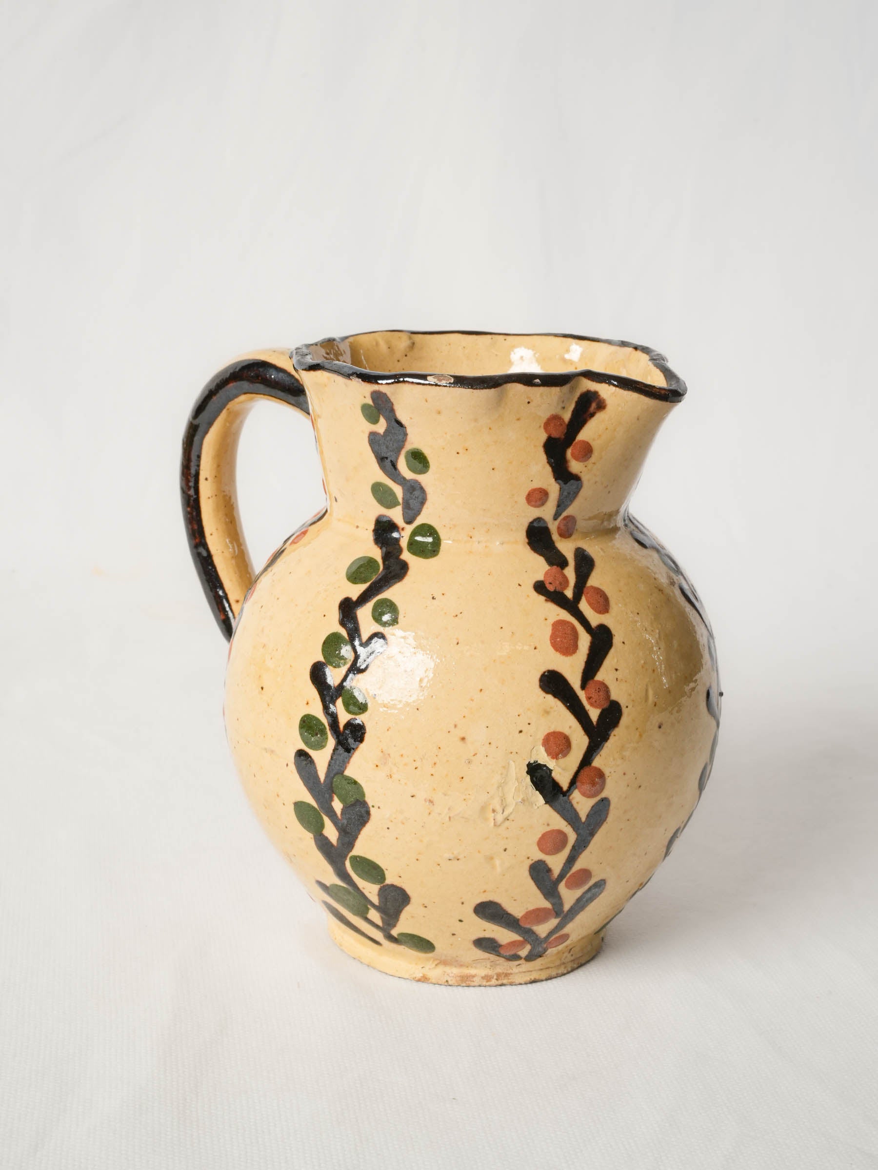 Pretty antique pitcher from Savoy - Yellow w/ foliage motifs 7"