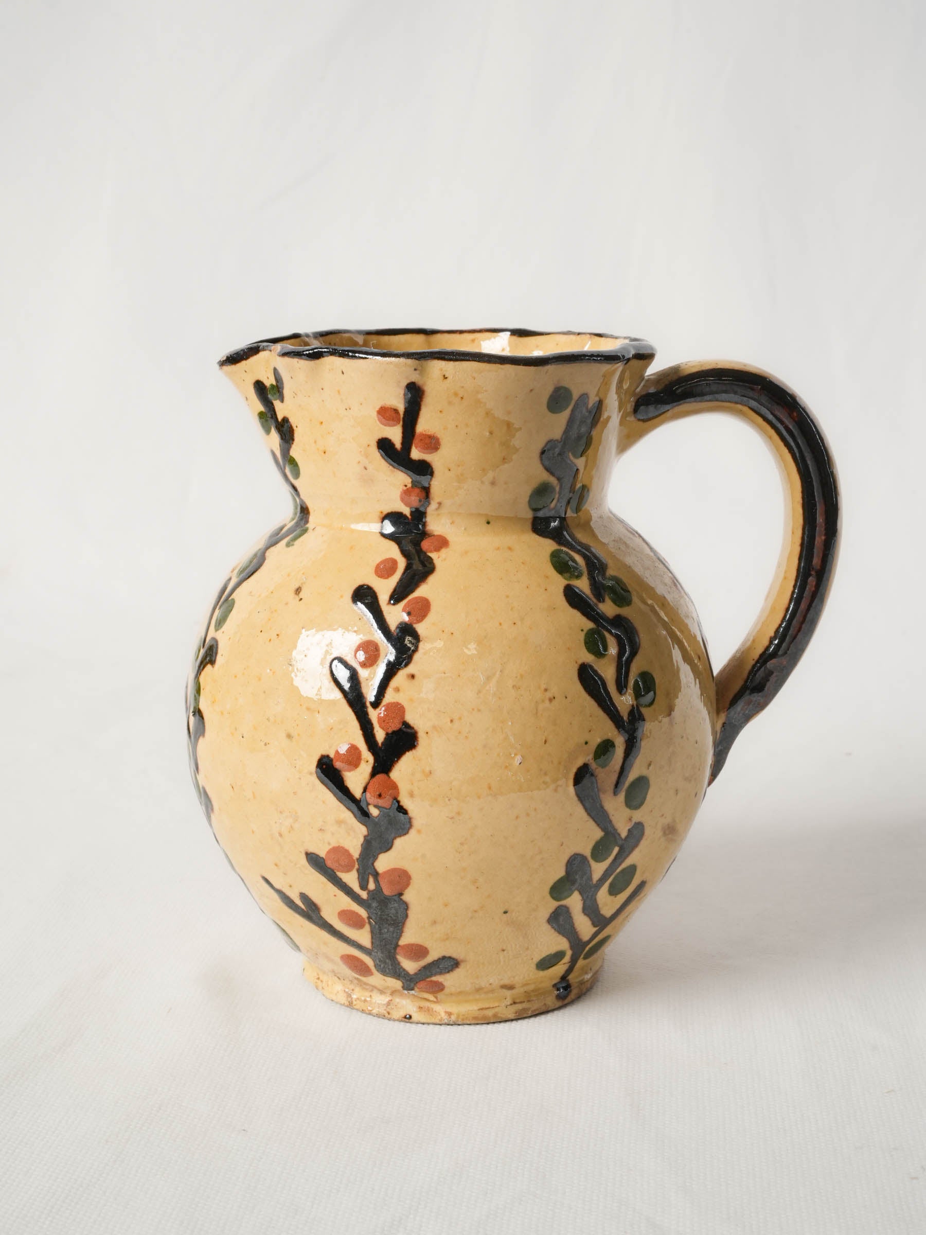 Pretty antique pitcher from Savoy - Yellow w/ foliage motifs 7"