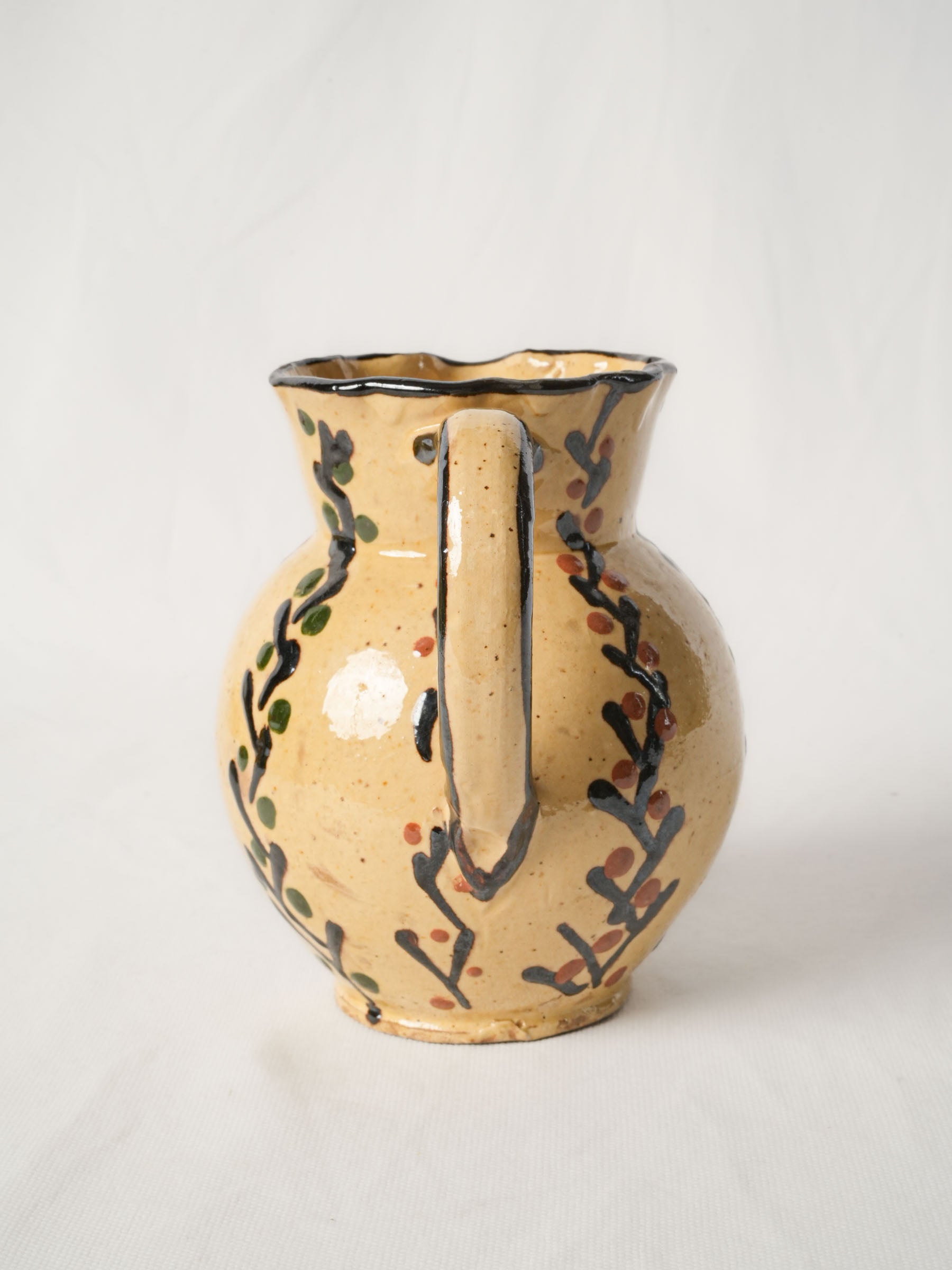 Pretty antique pitcher from Savoy - Yellow w/ foliage motifs 7"