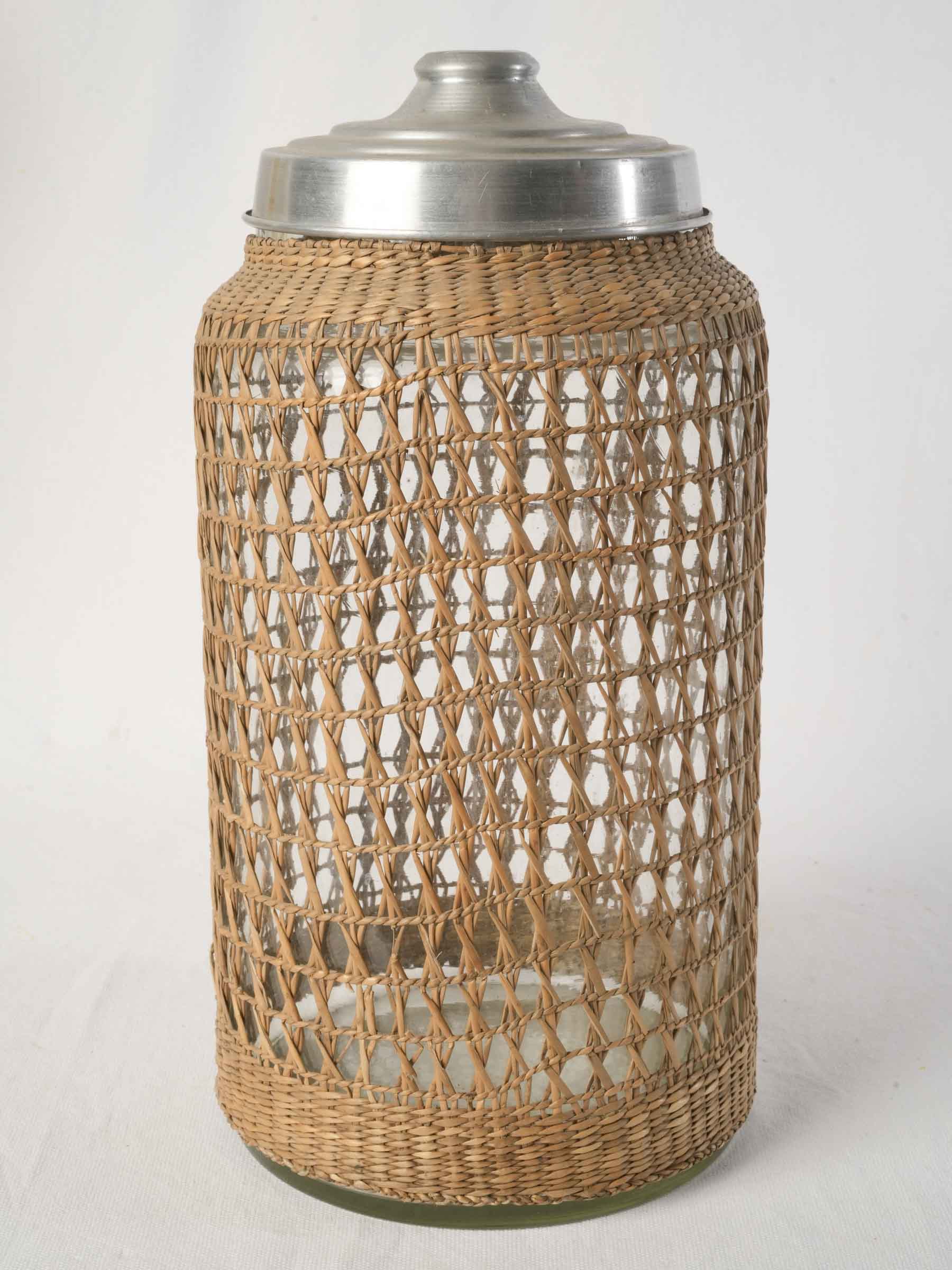 1960s rattan clad glass canister with aluminum lid - 15¾"