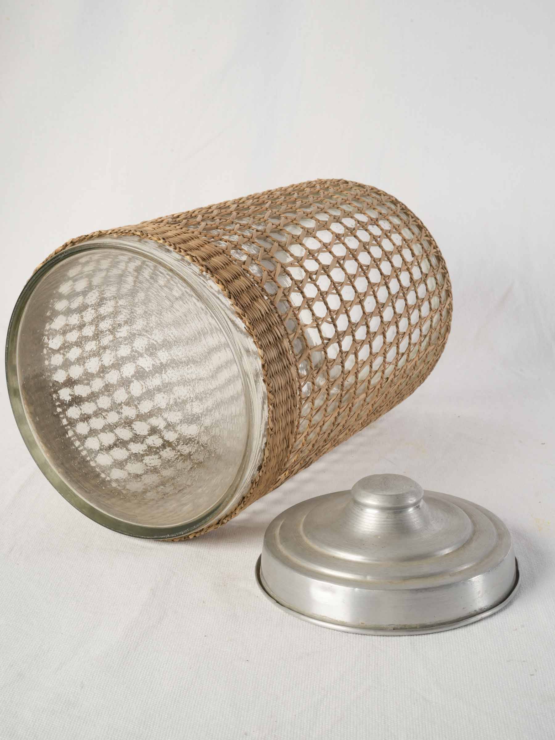 1960s rattan clad glass canister with aluminum lid - 15¾"