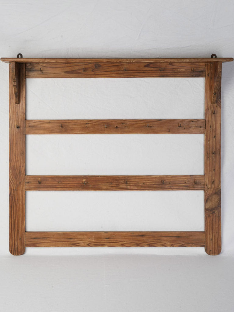 Vintage wall-mounted iron rack