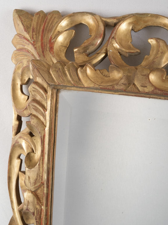 Intricate hand-carved wooden mirror