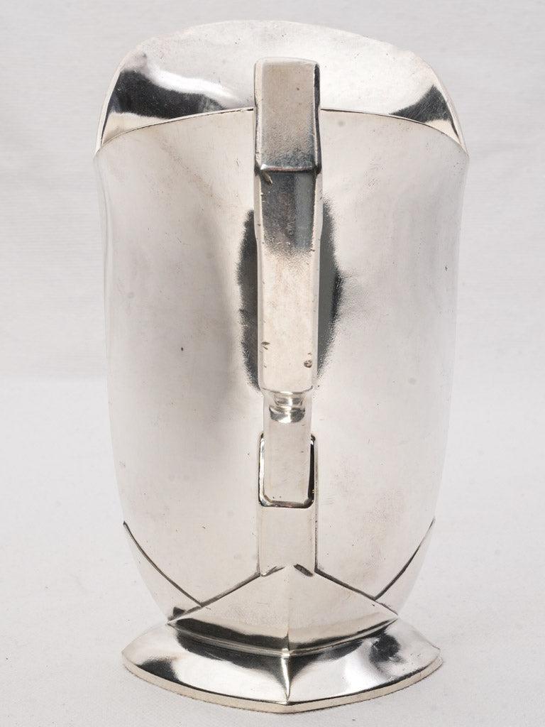 Sleek polished silver water jugs  