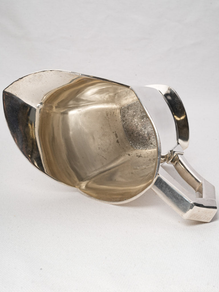 Celebrated craftsmanship Christofle pitchers  