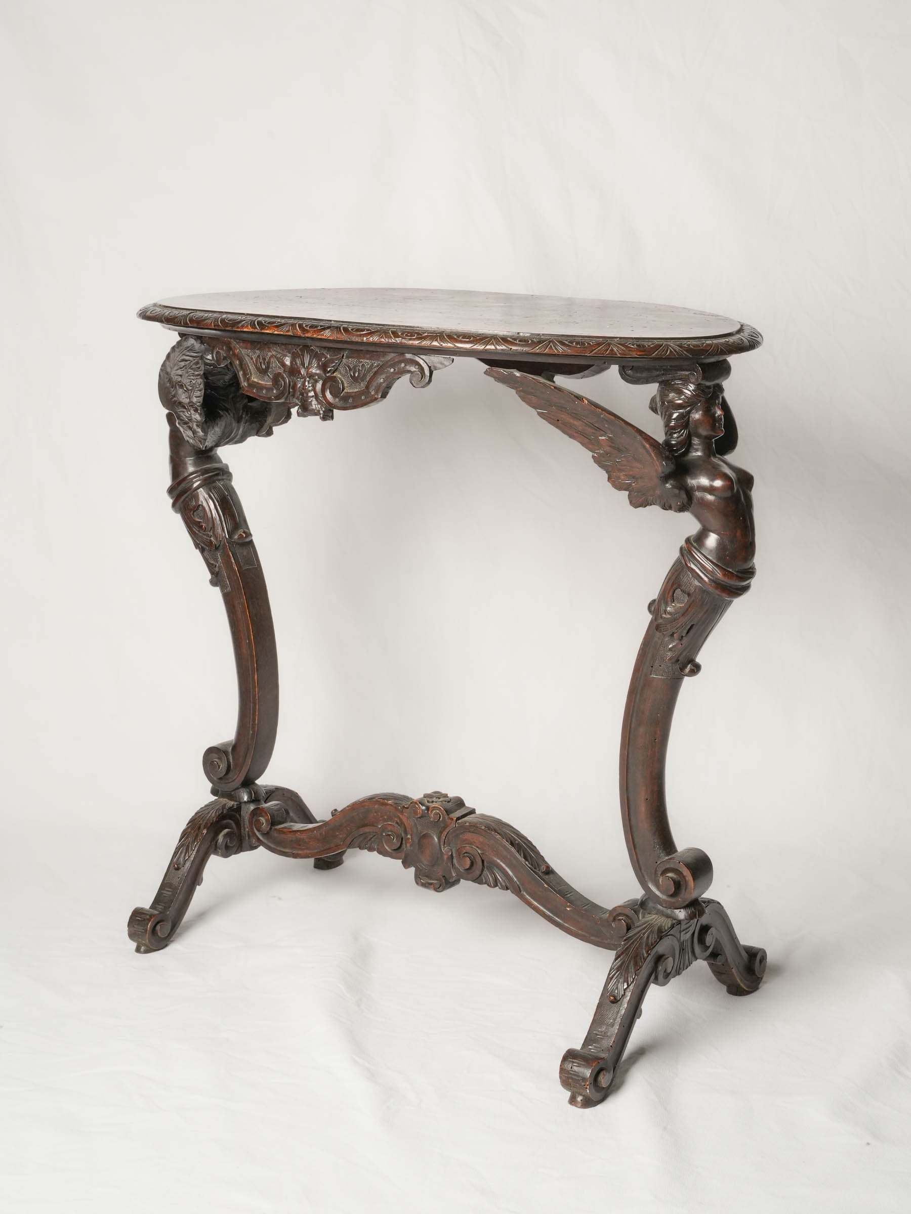 Napoléon III French beech oval side table w/ winged caryatids