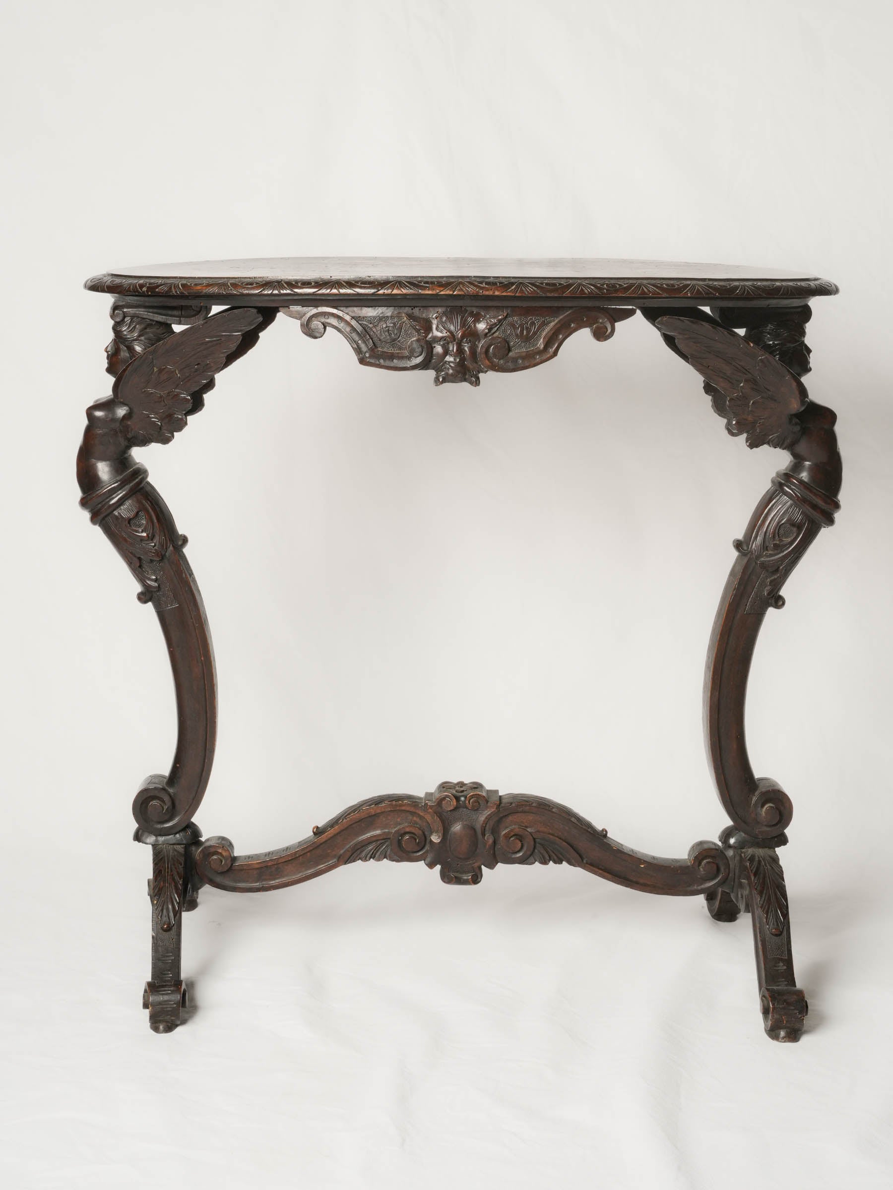 Napoléon III French beech oval side table w/ winged caryatids