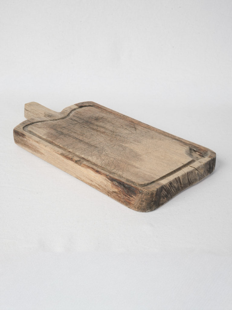 Patina-rich serving board with handle  