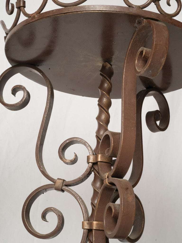 Sculptural twisted iron display tables