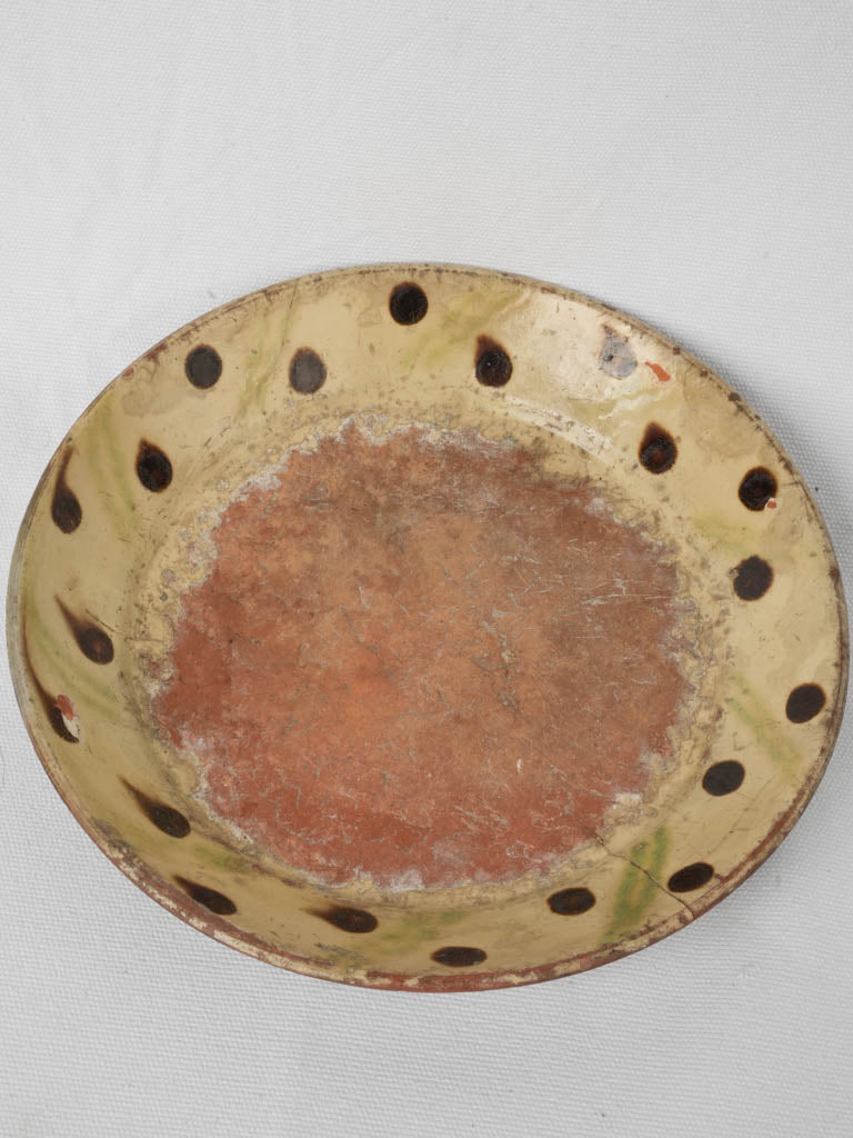 Antique rustic glazed terracotta plate