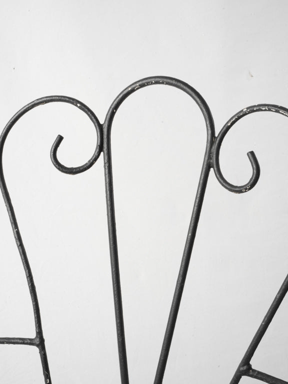 Timeworn patina wrought iron seats  