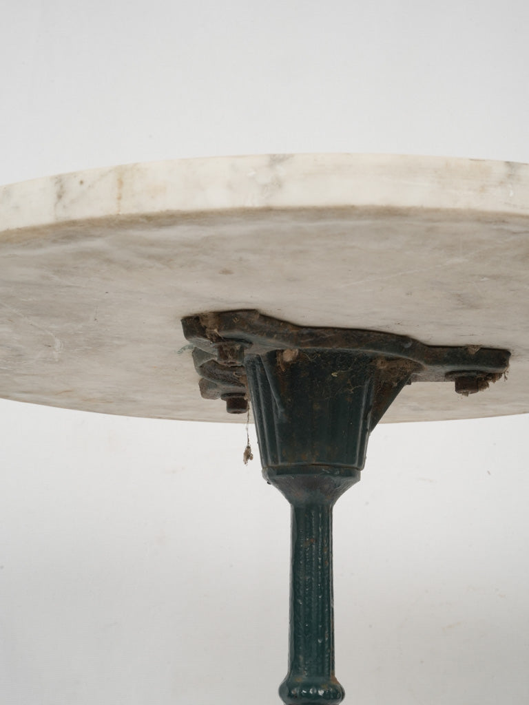 Rustic, worn, greenish-blue cast iron table