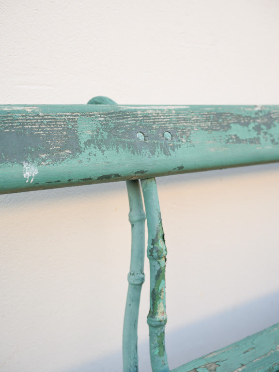 Rustic green-painted park bench