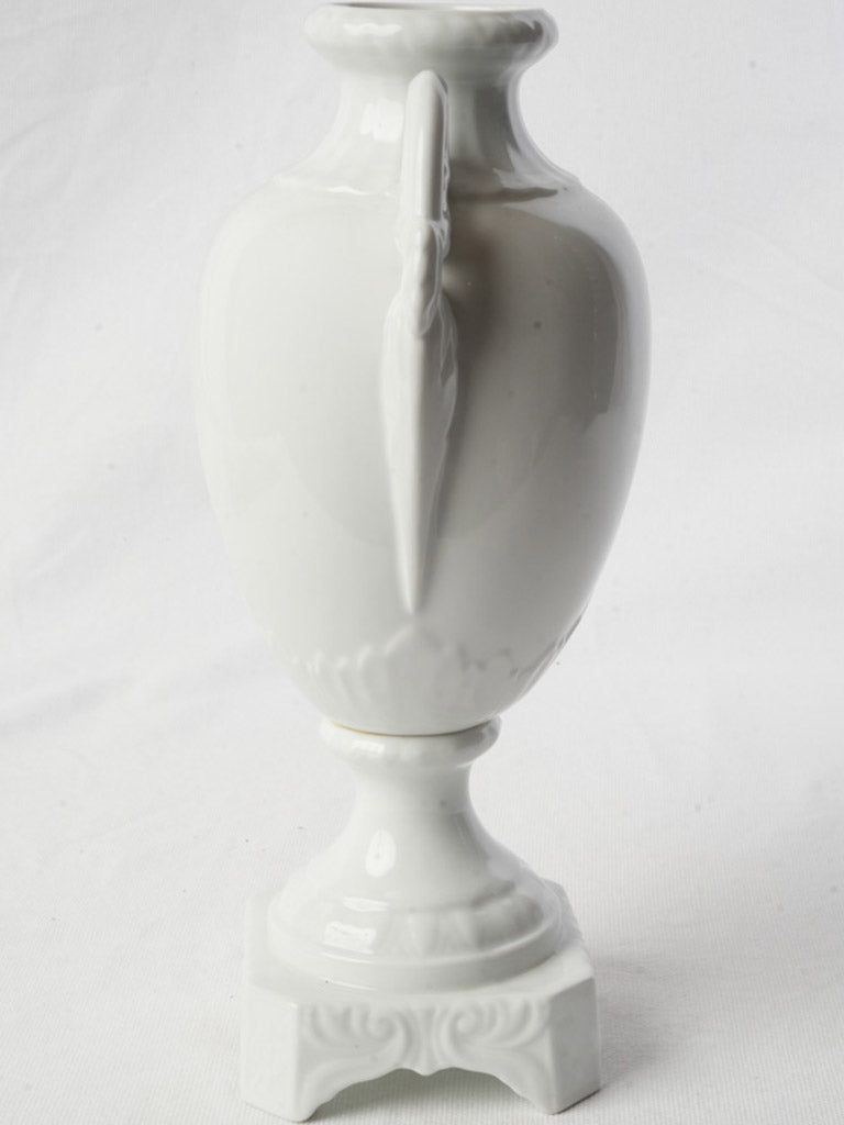 Sculpted twin-handled porcelain urn