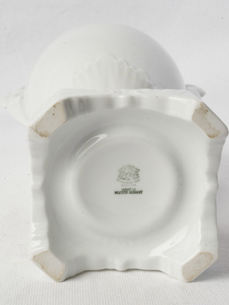 Antique-inspired white porcelain urn