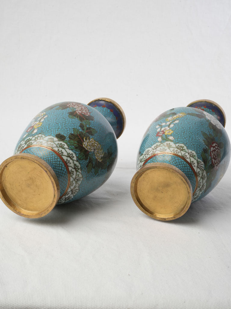 Graceful gilt-accented bronze vases  