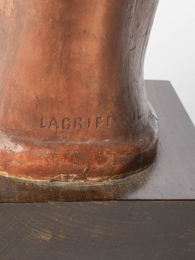 Elegant wooden-plinth terracotta sculpture  