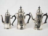 Exquisite wood-accented silver coffee pots