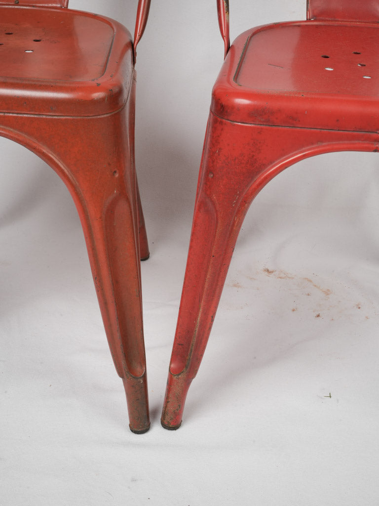 Elegant curved-back Tolix chairs