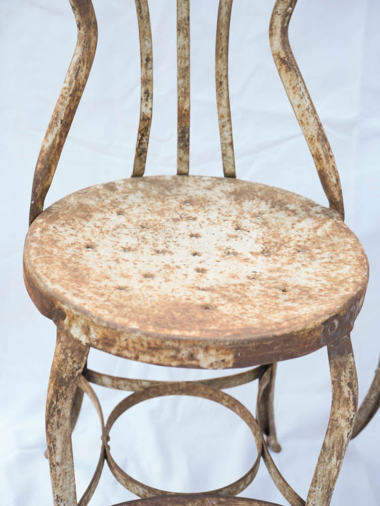 Eclectic curving steel chairs  