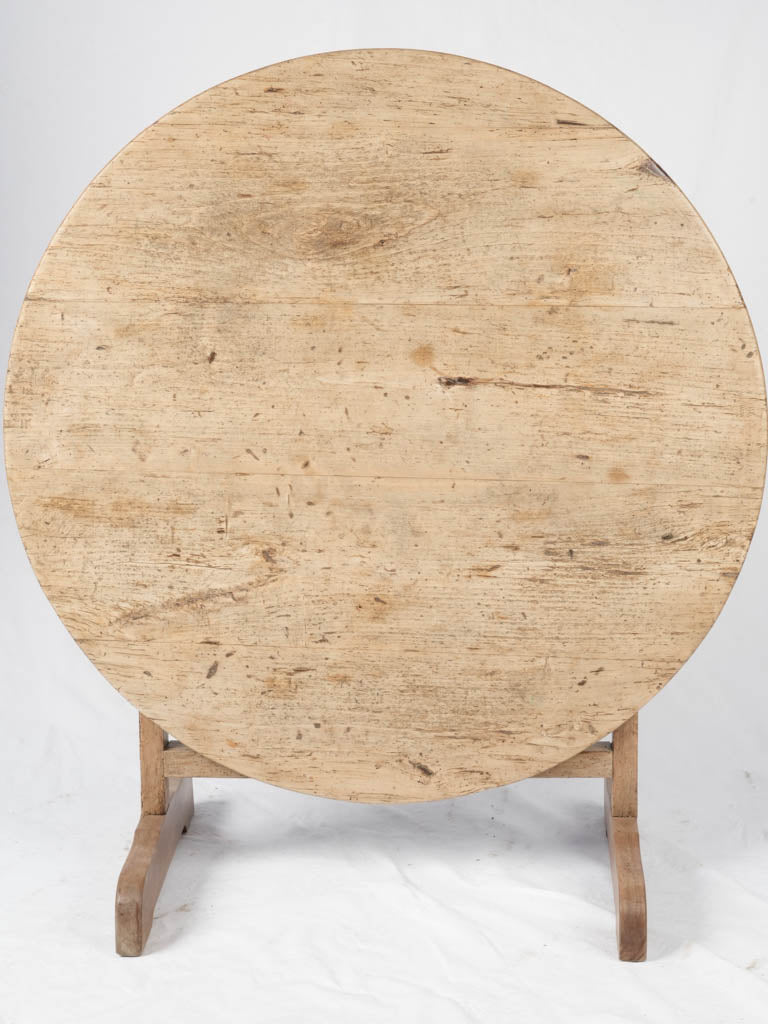 Weathered circular wooden cellar table  