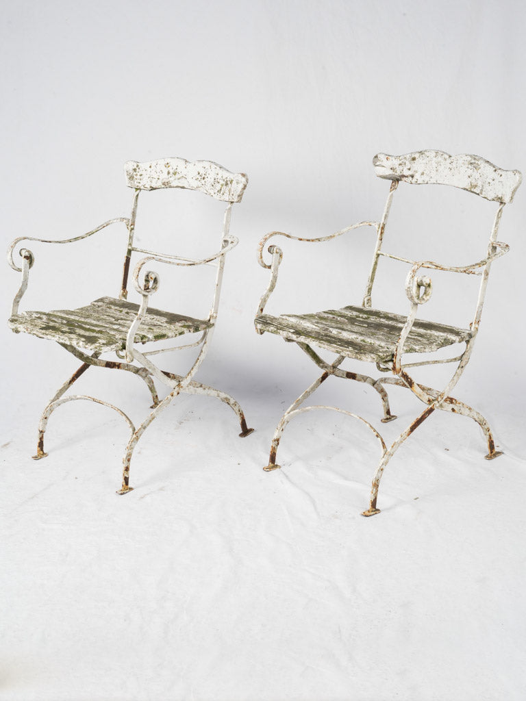 Antique wrought iron garden armchairs