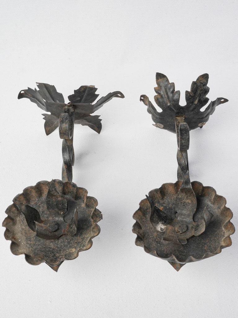 Artisanal folk art iron sconces  