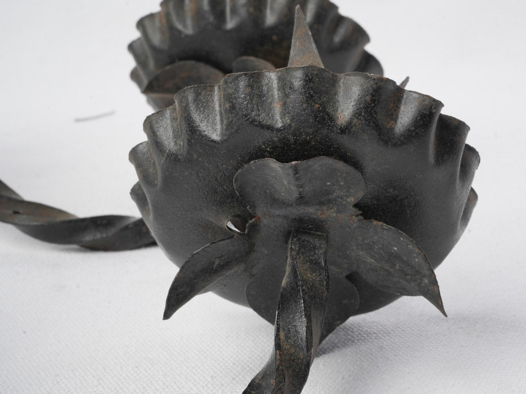 Ornamental black iron sconces  
