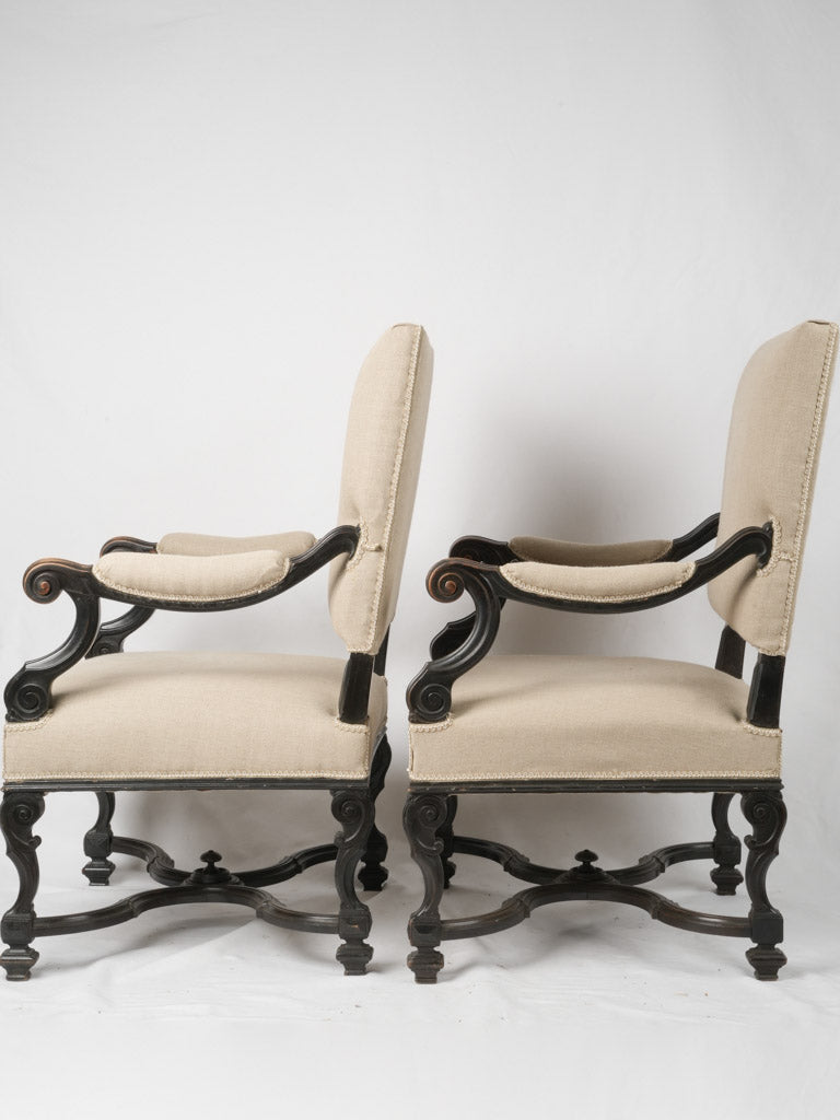 Dark lacquered Louis XIV armchairs