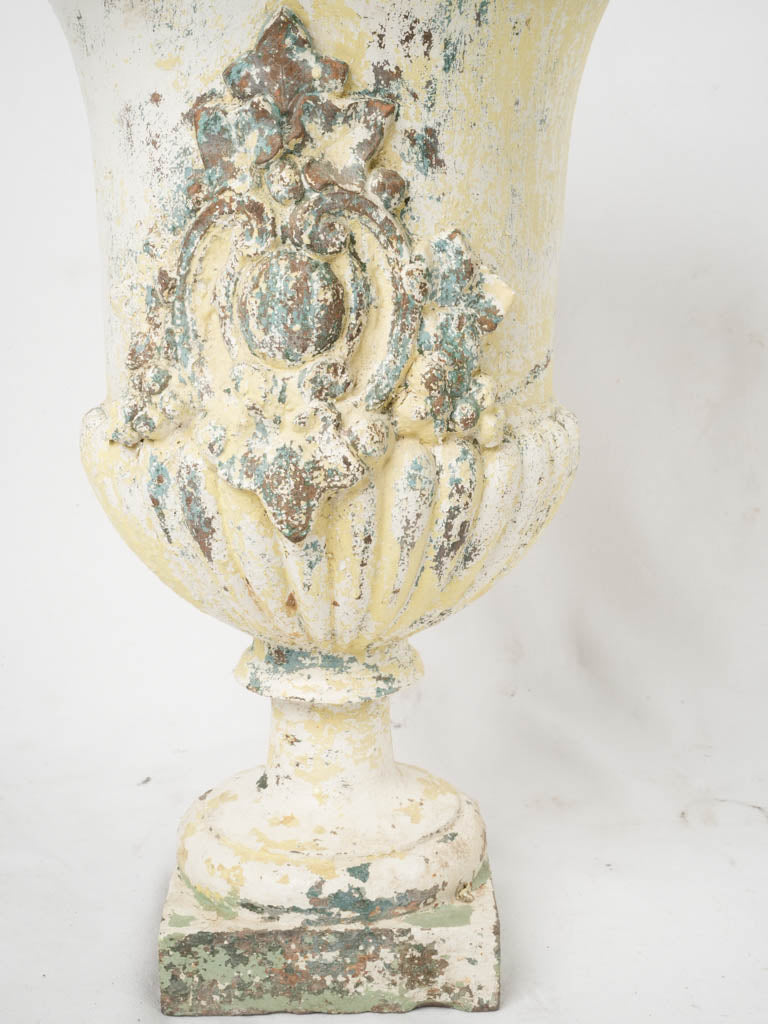 Aged, elegant painted Medici urns