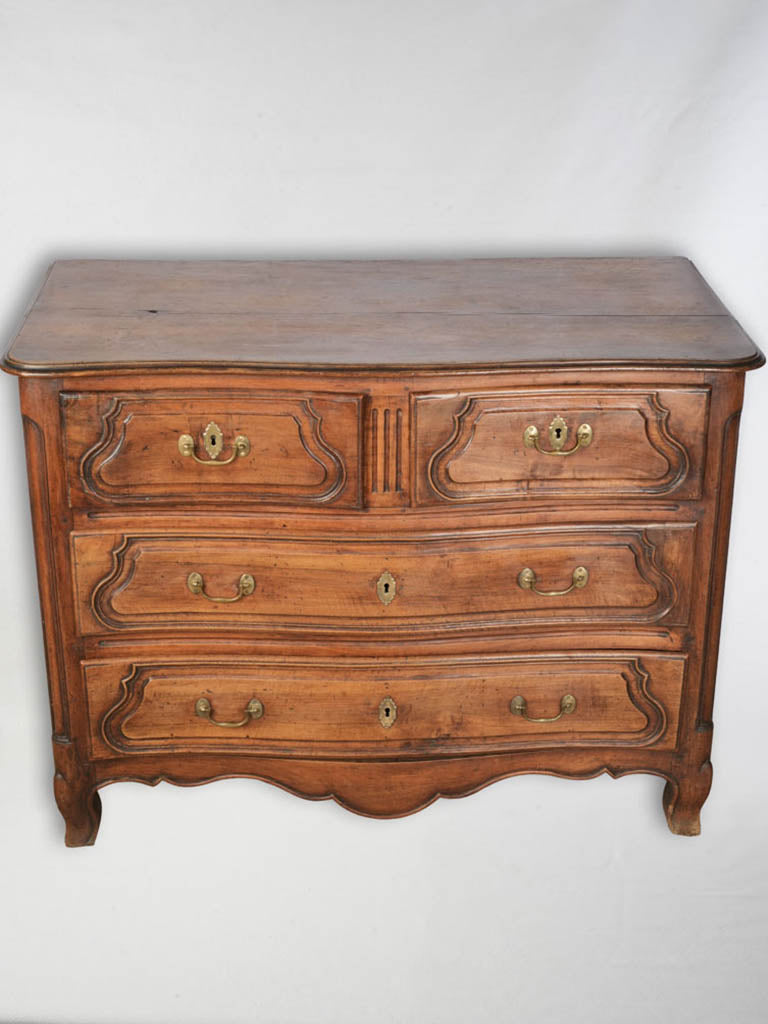 Elegant walnut serpentine front dresser