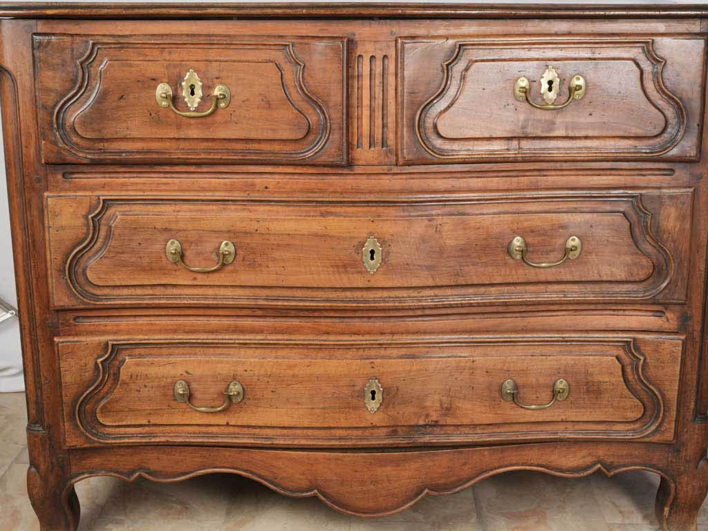 Molded cartouche walnut commode