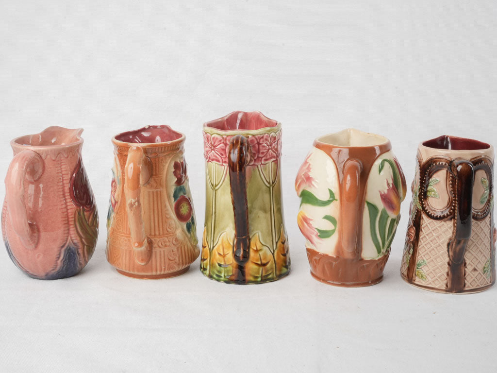 Set of Five Early 20th Century French Art Nouveau Majolica Pitchers