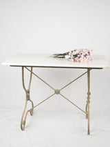 Elegant green-painted iron outdoor table