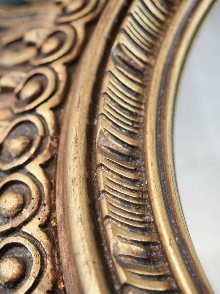 Intricately carved wooden mirror