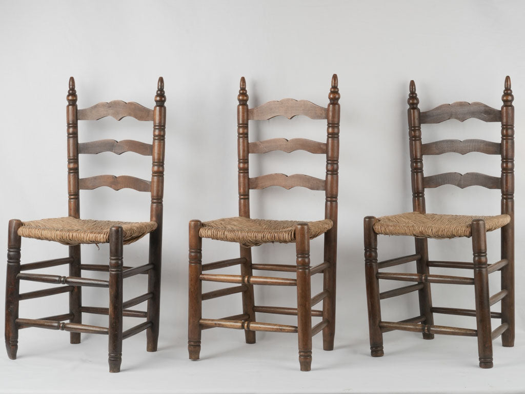 Aged French wooden ladderback dining chairs