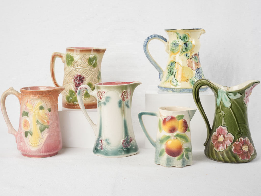 Set of Six Early 20th Century French Art Nouveau Majolica Pitchers