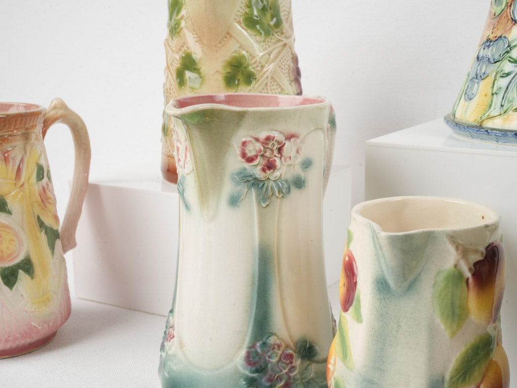 Set of Six Early 20th Century French Art Nouveau Majolica Pitchers