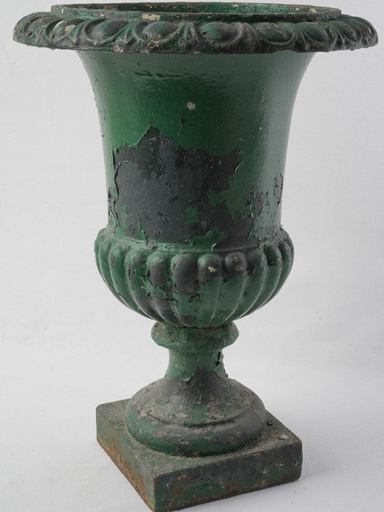 Distressed cast iron garden urn