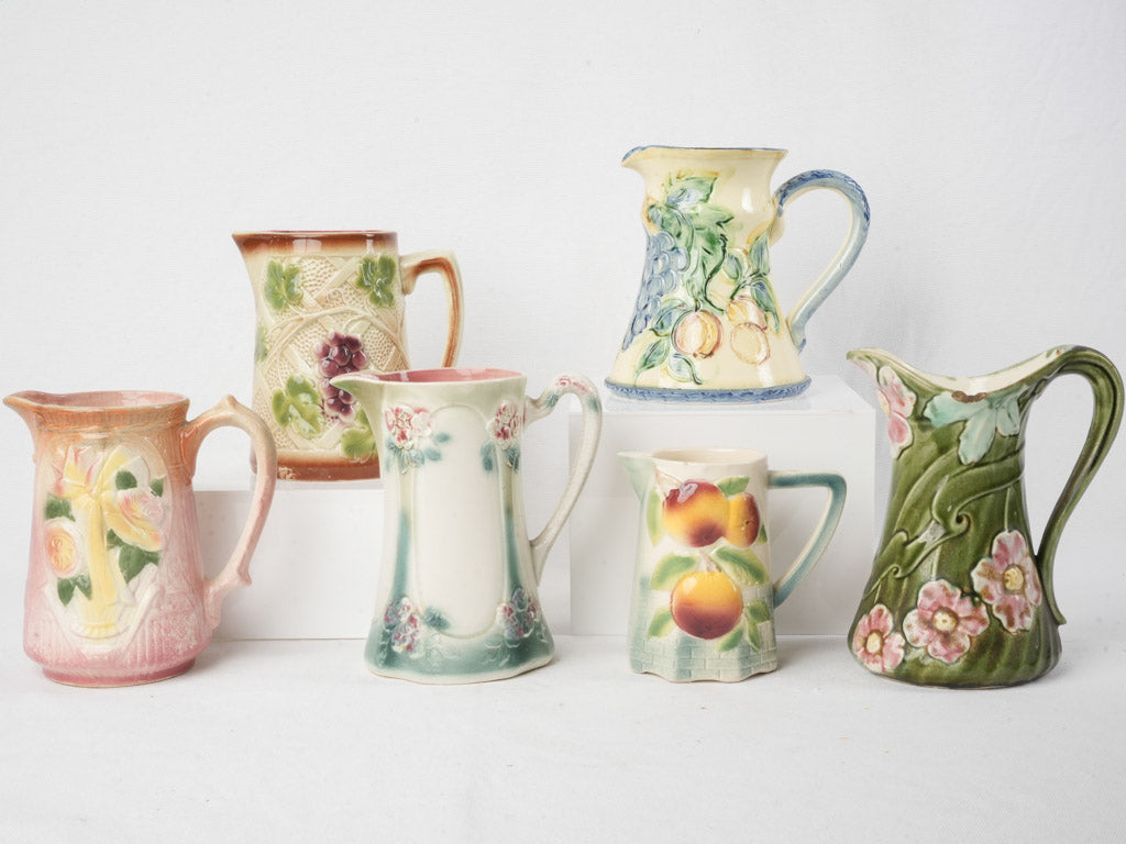 Set of Six Early 20th Century French Art Nouveau Majolica Pitchers