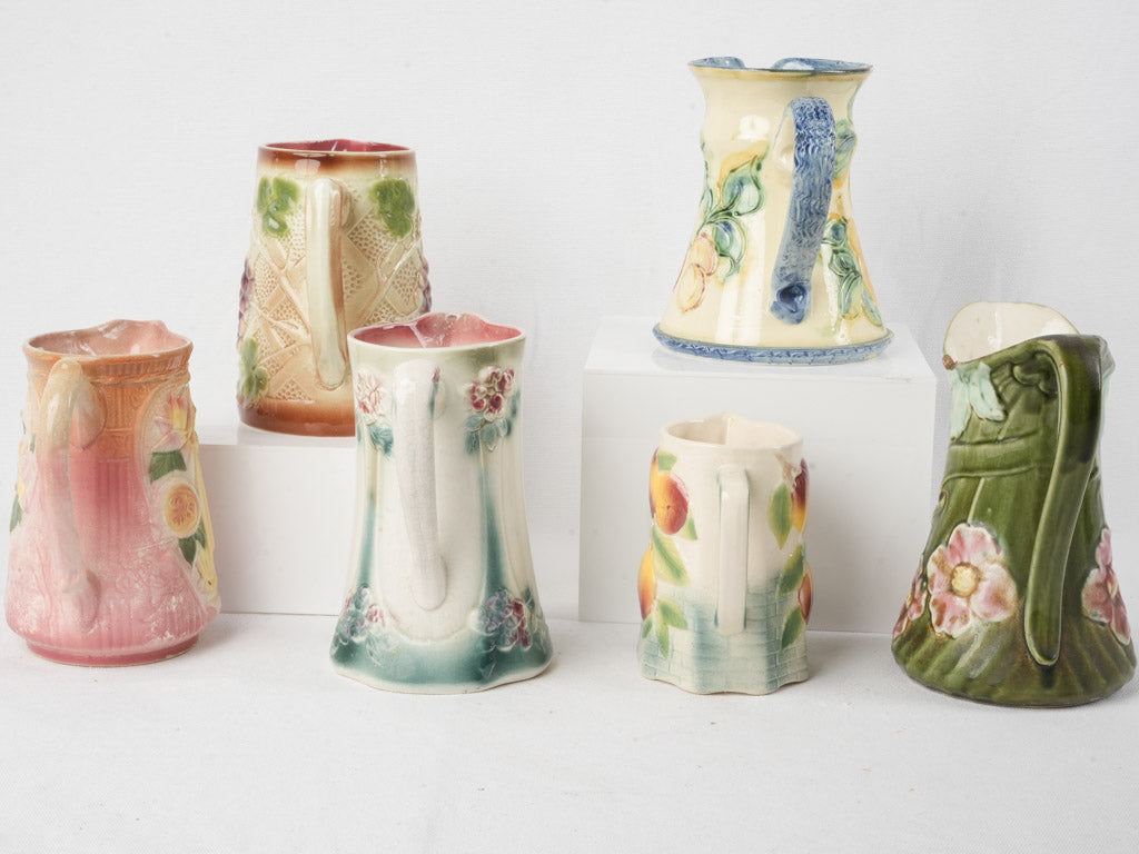 Set of Six Early 20th Century French Art Nouveau Majolica Pitchers
