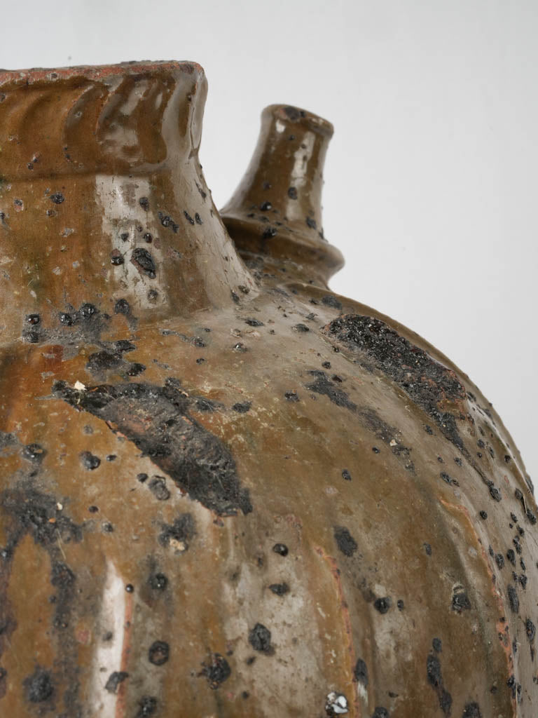 Historical brown glazed terracotta oil pot