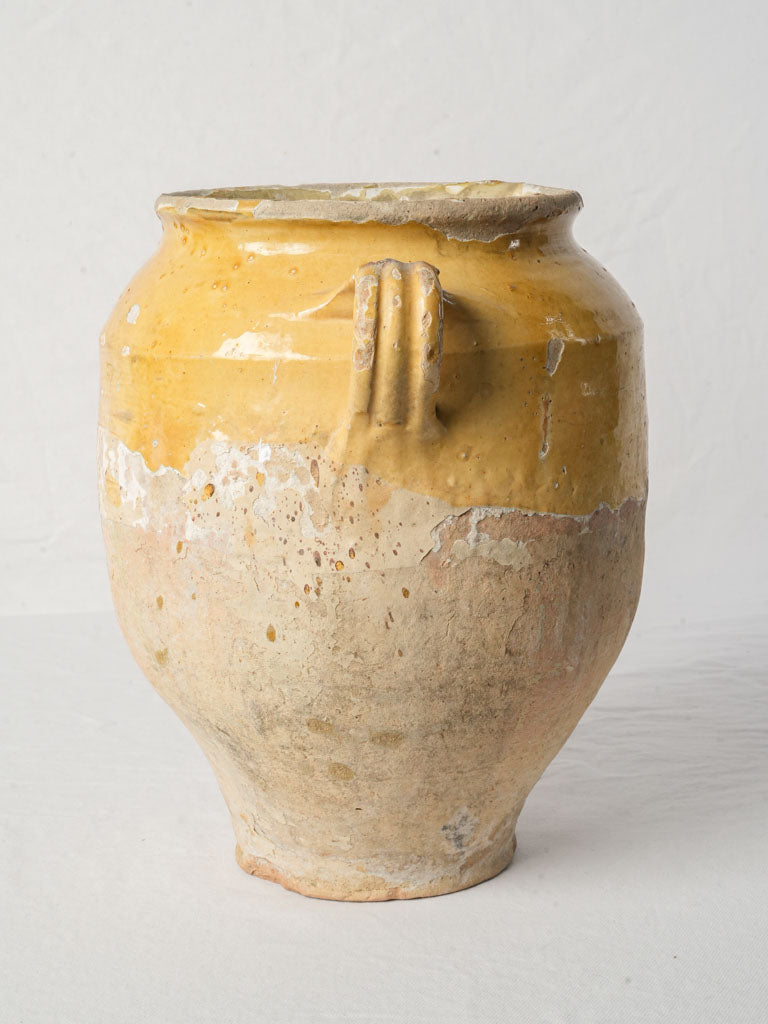 Aged hand-thrown clay vessel