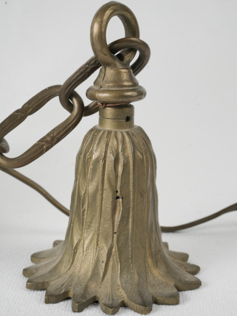 Finial-adorned brass pendant lighting
