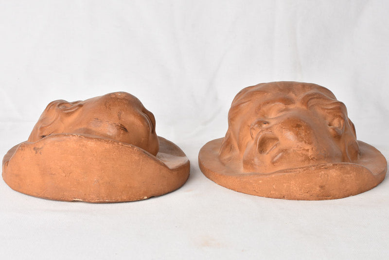 Chubby-faced cherub sculptures indoors/outdoors